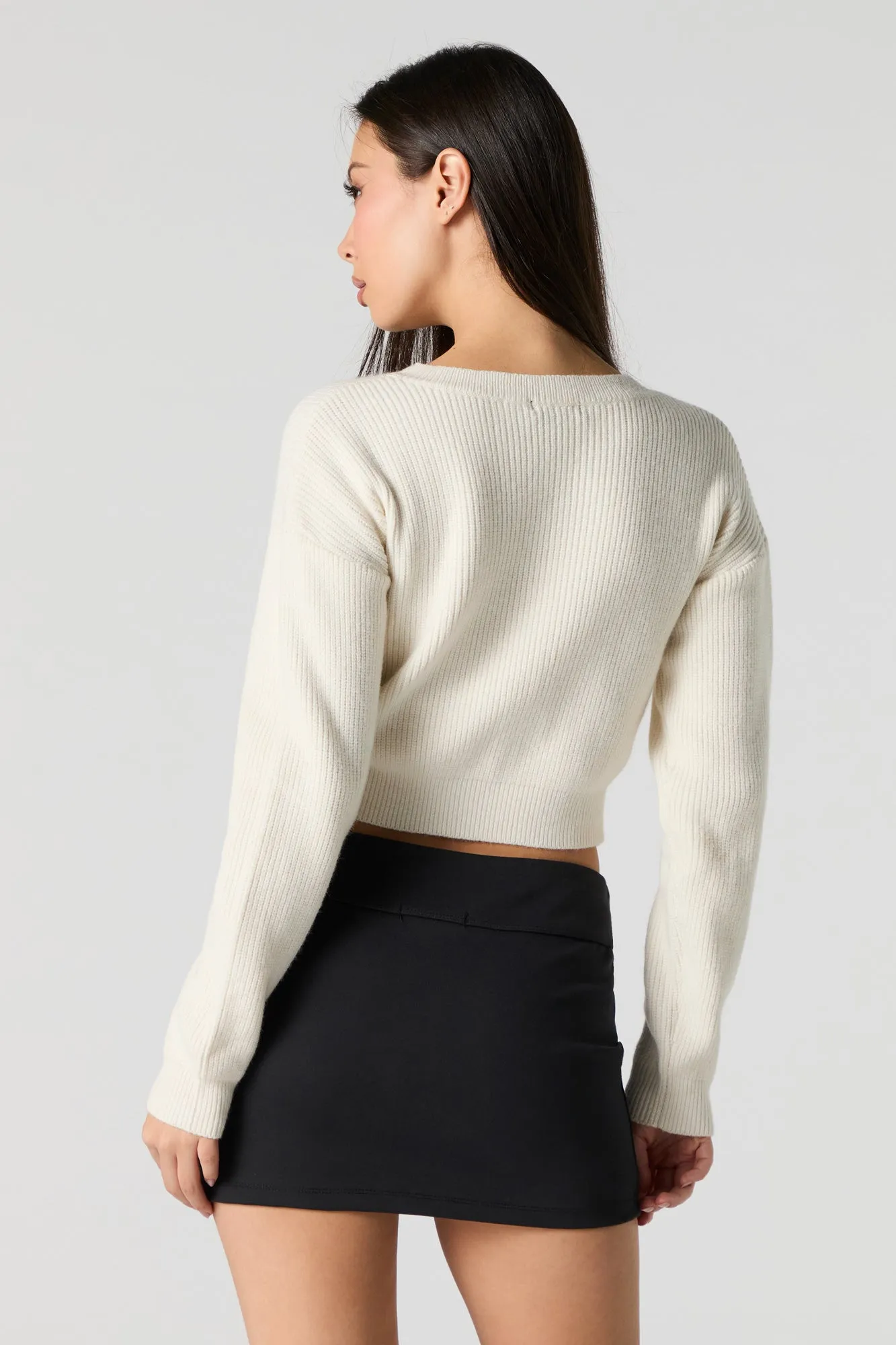 Chandail court en tricot côtelé avec motif brodé