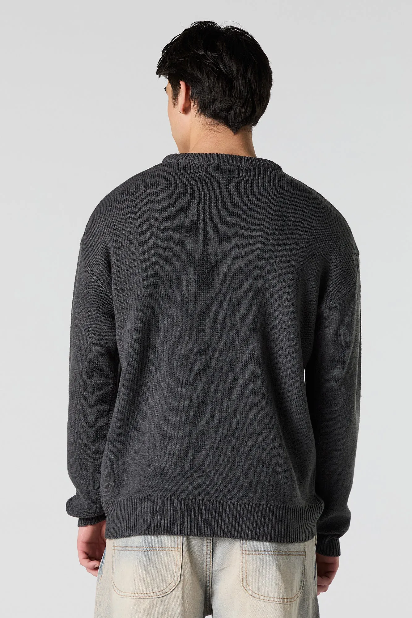 Chandail en tricot jacquard avec texte gothique