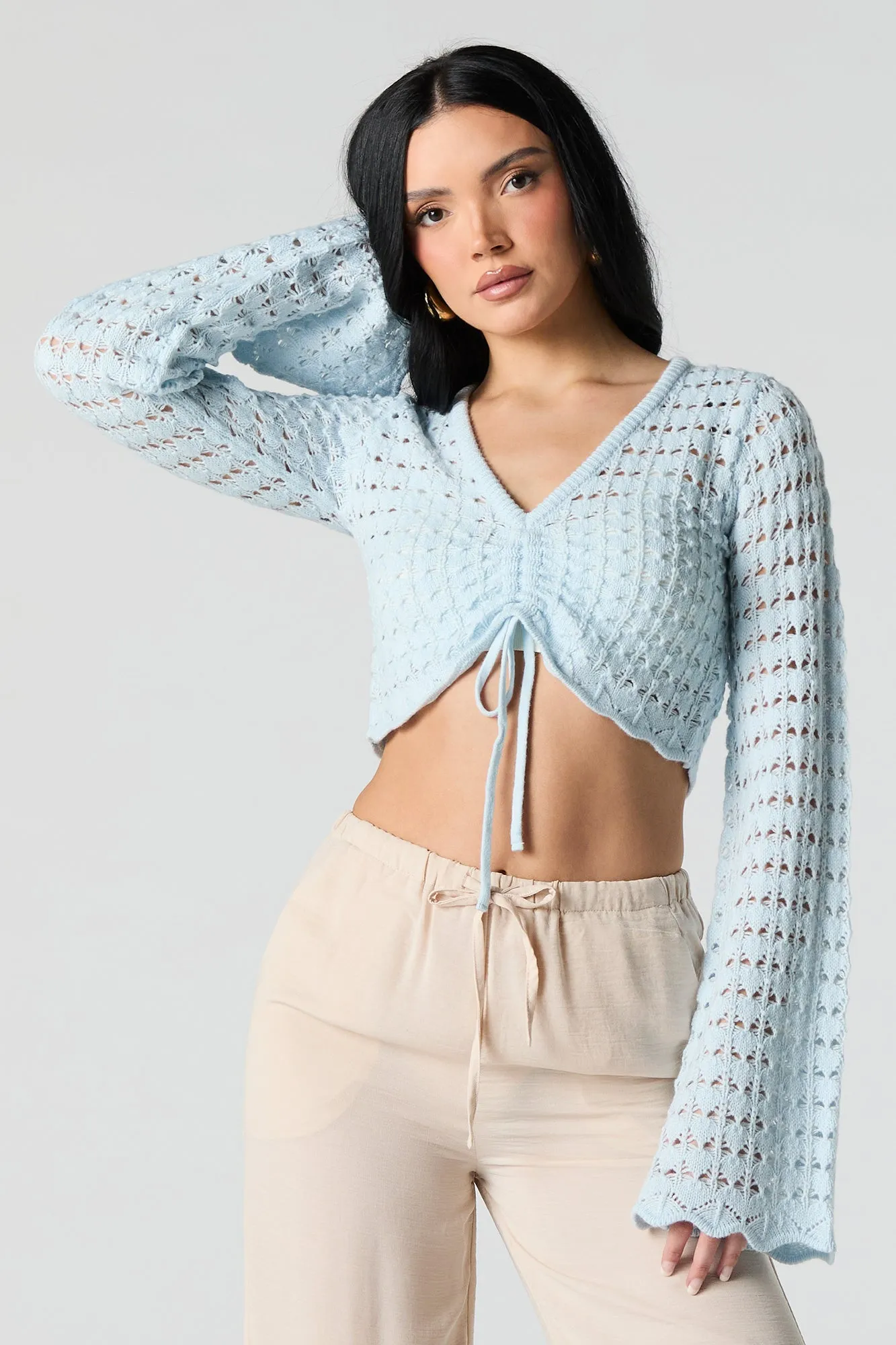 Haut crocheté court à manches longues avec taille coulissante